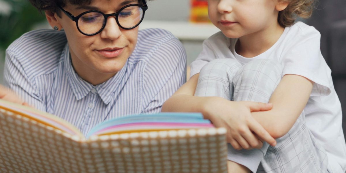 A parent and child learning together at home, illustrating family engagement in inquiry-based education.