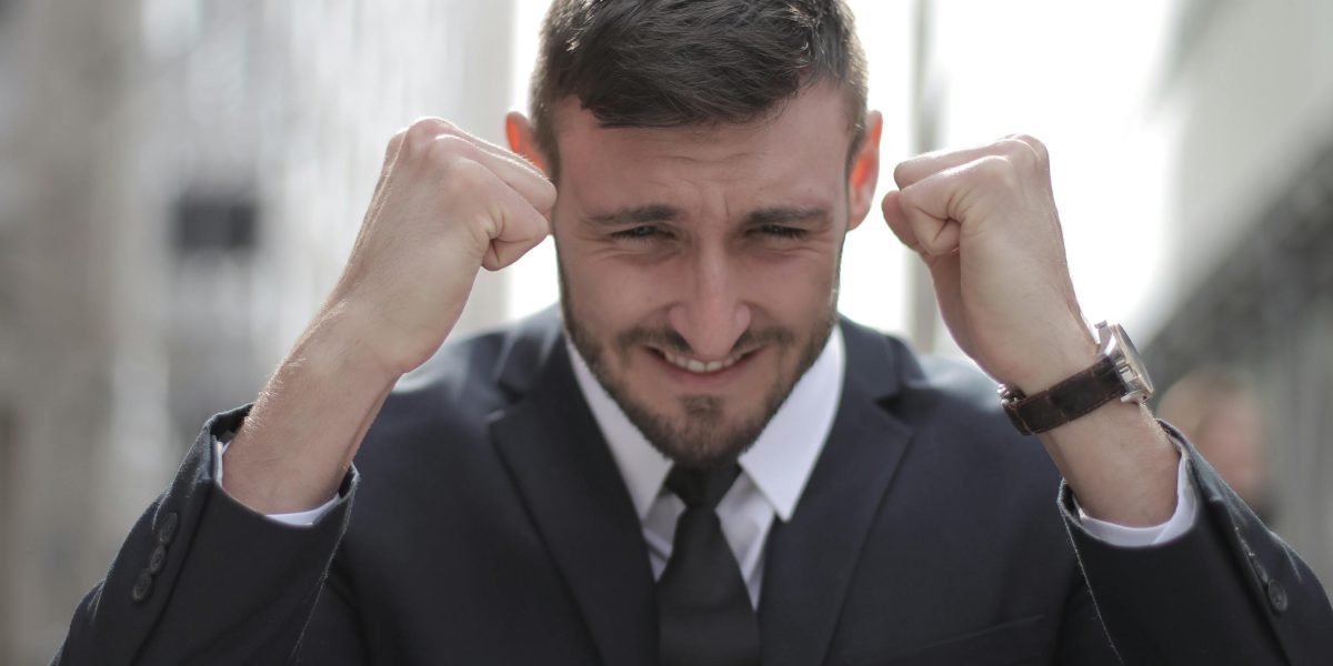 A professional celebrating a significant career achievement or promotion, linked to skill development.