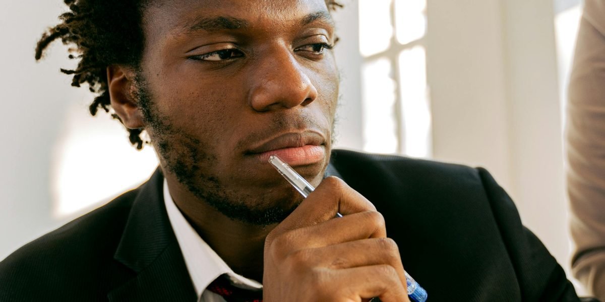 A person in a professional setting thoughtfully evaluating options, reflecting improved decision quality.