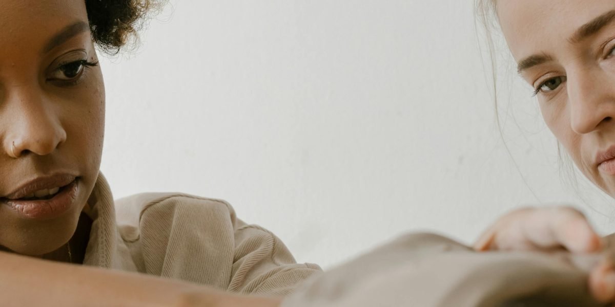 A person thoughtfully engaging with new information, symbolizing the acquisition of critical thinking skills for career development.