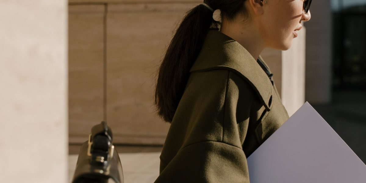 A person confidently reviewing notes, preparing for an important job interview with a positive mindset.