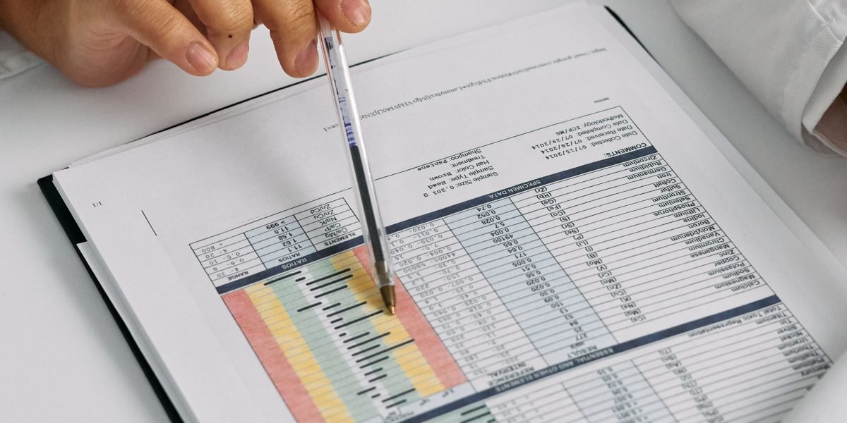A professional meticulously reviewing documents, symbolizing the critical evaluation of information, especially AI outputs.