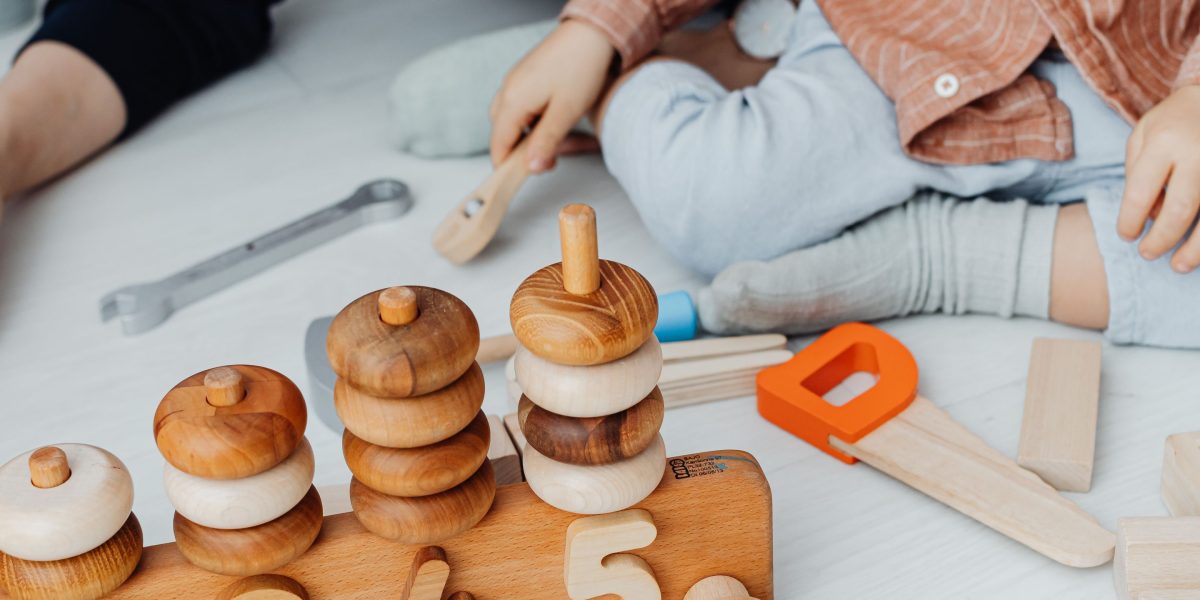 A child engaged in hands-on learning with Montessori-style educational materials, fostering autonomy and exploration.